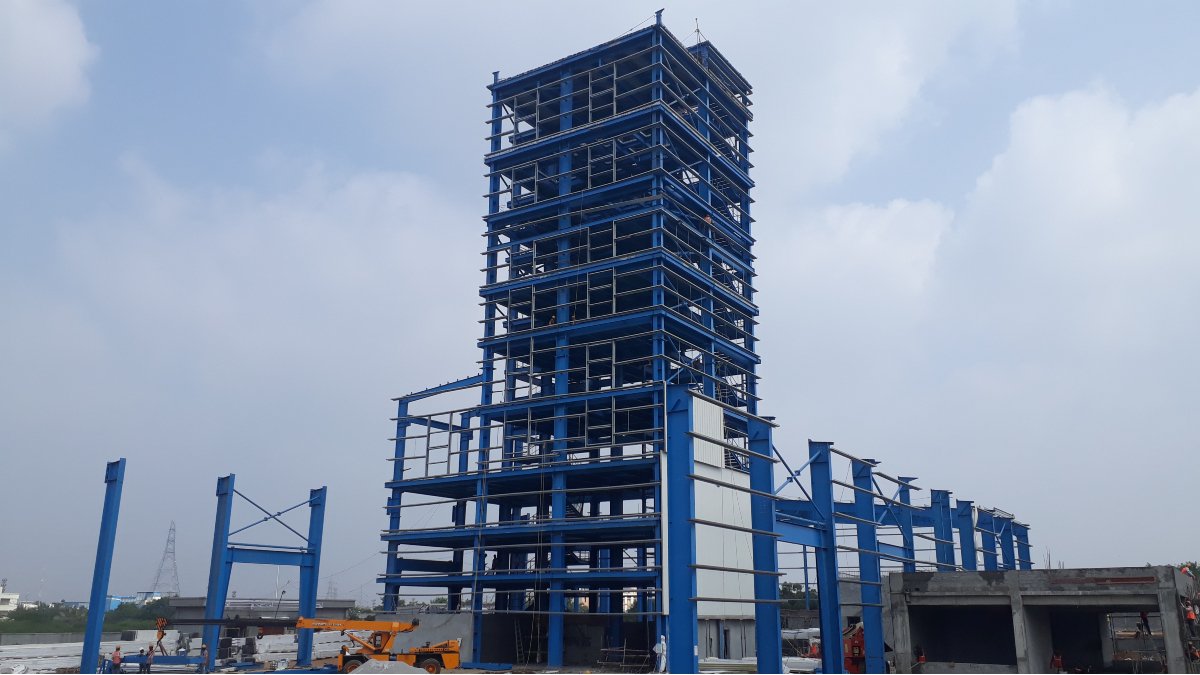 PEB plant, Multi-storey innovation, Industrial construction, Efficient space use, Pre-engineered buildings, Vertical expansion, Structural engineering, Seismic resilience, High-rise PEB, Innovative fabrication, Logistics management, Industrial design revolution