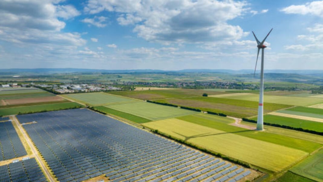 Wind turbines and solar park - aerial view Gensol, Gujarat, solar projects, 116 MW, renewable energy, Paschim Gujarat Vij Co. Ltd., EPC revenue, grid-connected solar, infrastructure, solar power engineering,