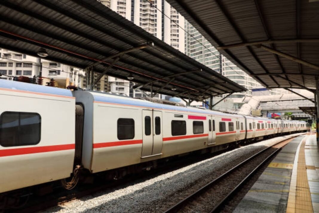 Passenger train in train station of Kuala Lumpur, Malaysia Gour Kishor Ghosh Metro Station, Kolkata, Kavi Subhash-Biman Bandar (Airport) Corridor, Orange Line, structural construction, Salt Lake connectivity, modern amenities, steel roofing structure, viaduct construction, state-of-the-art amenities, escalators