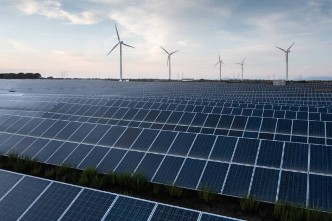 Solar panels and wind turbines producing green energy for clean environment. East Coast Railway, ECoR, solar power plants, 21,826 KWP, Indian Railways, Green Transporter, renewable energy, solar installations, sustainability, infrastructure modernisation.