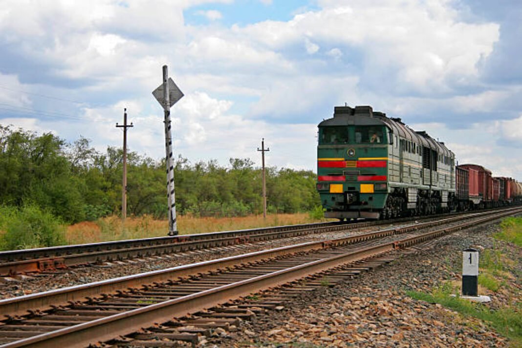 Railroad with an approaching freight train Bengaluru, direct railway lines, Indian government, transportation network, connectivity, land acquisition, new tracks, infrastructure upgrade, economic growth, rban mobility, infrastructure modernisation