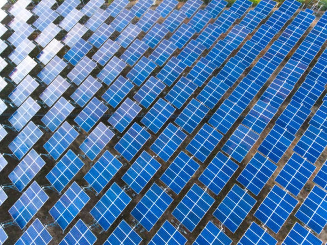 Top view Solar Farm with sunset on the background Kerala, Consultancy, Solar BESS, Battery Energy Storage System, Renewable Energy, Grid Stability, Design, Implementation Strategies, Energy Storage, Project Timeline, Energy Management