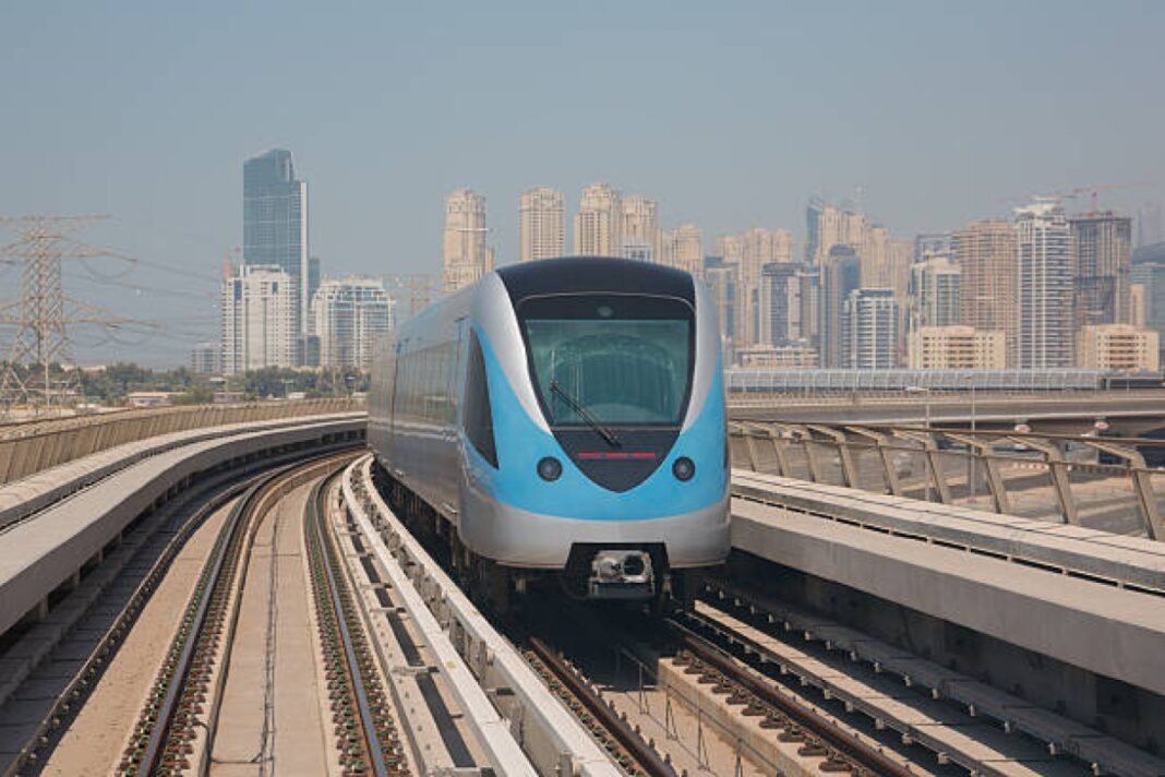 Dubai Metro Train on a railway. Kolkata Metro, third rail replacement, Blue Line, Girish Park station, metro modernisation, infrastructure upgrade, metro network expansion, new trains, sustainable transportation.