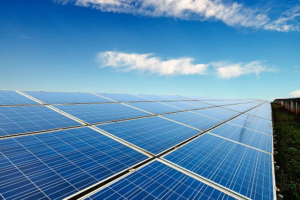 Solar panels in the blue sky white clouds in the background Gensol Wins Rs 7.8B EPC Contract for 150 MW Solar Plant