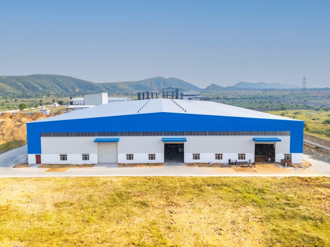 Svarn Infratel's Advanced Cable Manufacturing Facility Steel exoskeleton, sustainable architecture, innovative design, modern workspace, Noida corporate office, 42mm Architecture, structural engineering, advanced construction, green terraces, architectural innovation, APL Apollo.