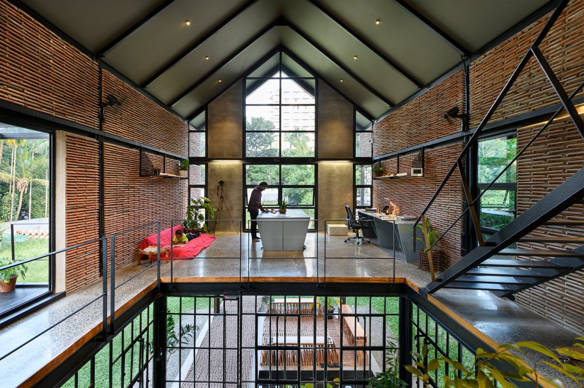 Koshish House, Kochi, sustainability, architectural design, material reuse, terracotta tiles, steel repurposing, creative design, elevated structure, dynamic spatial experience, natural light, local collaboration, eco-friendly construction, modern architecture