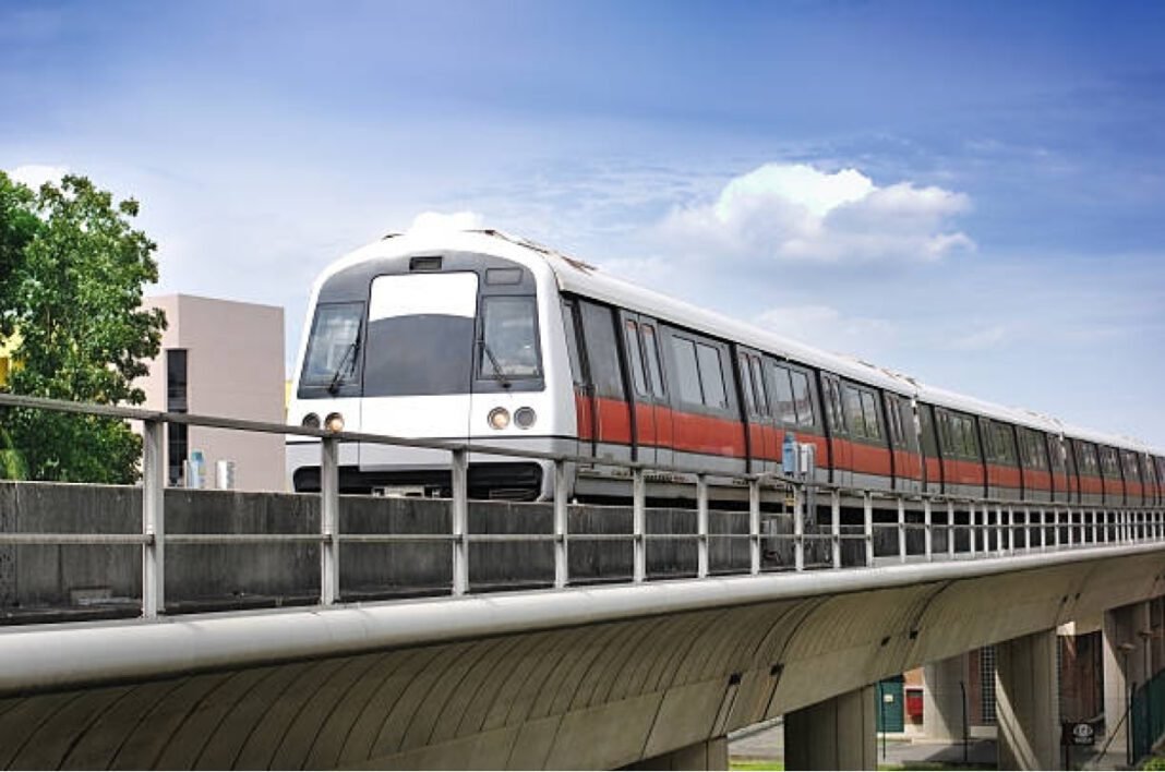 Train on the track against blue sky. Andhra Pradesh, Double-Decker Metro, Vijayawada, Visakhapatnam, Metro Rail, Urban Mobility, National Highways, Infrastructure, Transportation, Chief Minister N Chandrababu Naidu