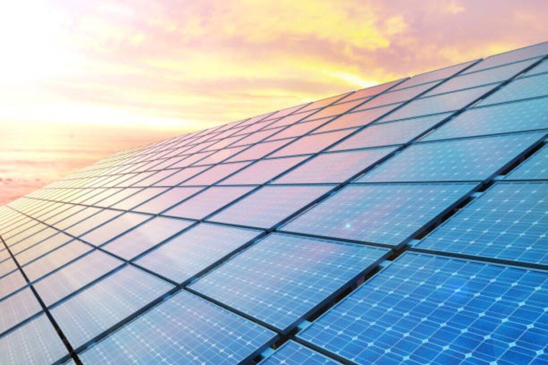 colose up solar panels on sunset. Tata Power, renewable energy procurement, 500 MW renewable projects, solar energy, wind energy, hybrid projects, hydroelectric power, energy tariffs, green energy, TPTCL, sustainability.