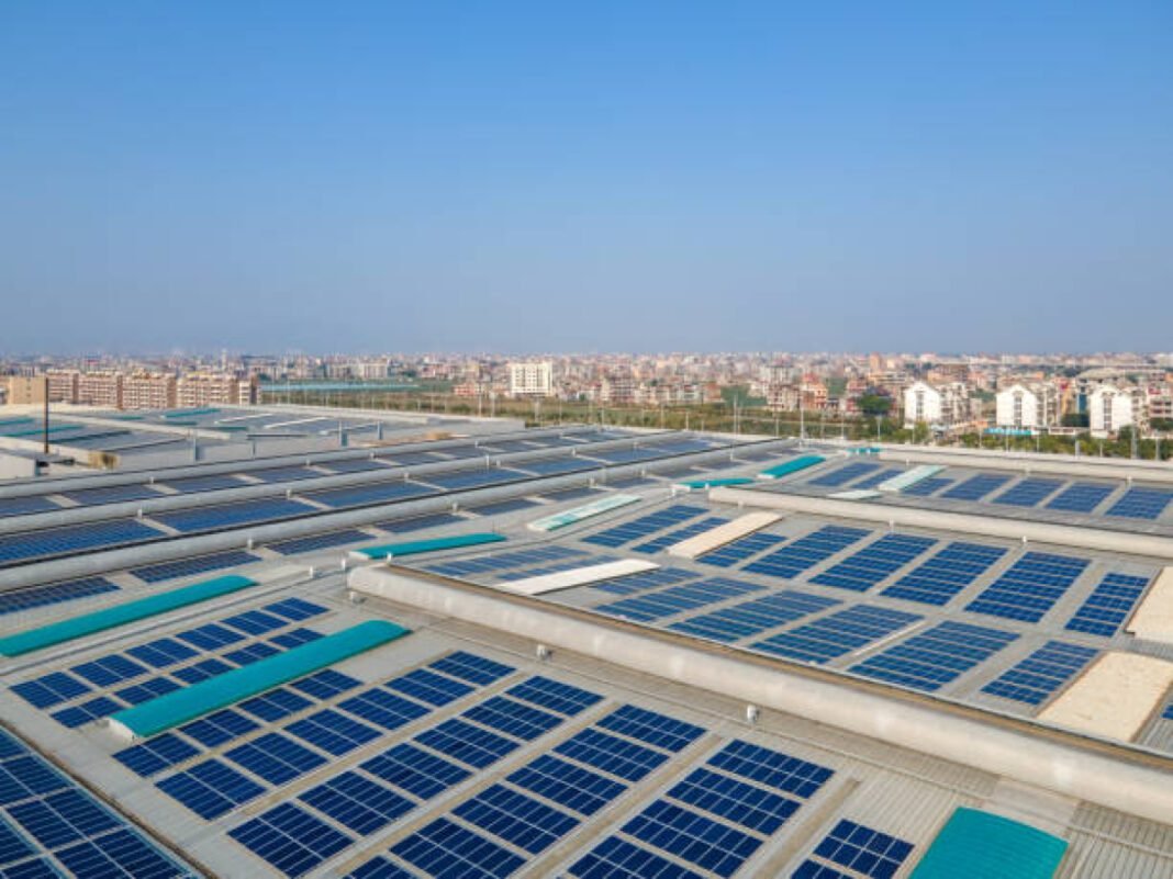 The factory building has installed solar panels POWERGRID, rooftop solar, PM Surya Ghar, renewable energy, solar tenders, northern region, western region, clean energy