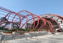 Petrapole Passenger Terminal: A Sustainable Steel Gateway Petrapole Passenger Terminal, Tata Structura, India-Bangladesh border terminal, sustainable transit architecture, Creative Group LLP, land port infrastructure, steel hollow sections, Tata Structura steel, parametric shell design, border terminal design, international land port, tensile fabric roof, architectural innovation, seashell-inspired structure, barrel form terminal, border logistics hub, sustainable border design, passenger terminal India, steel in transit infrastructure